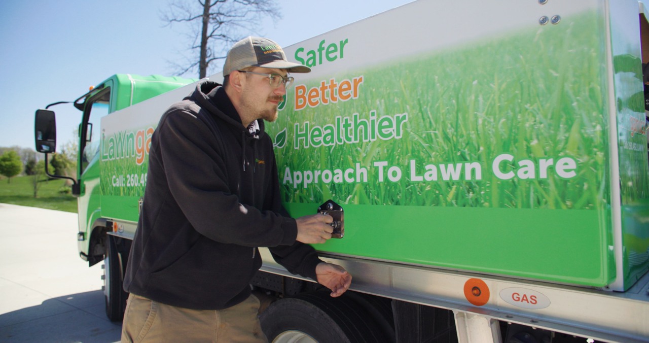 Lawnganics team member at truck on-site